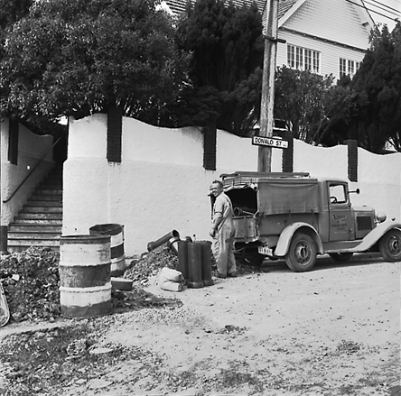 c. Road works, workmen and associated machinery, front end tractor, roller, grader, crane, trucks, motor vehicles