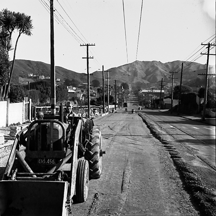 e. Road works, workmen and associated machinery, front end tractor, roller, grader, crane, trucks, motor vehicles