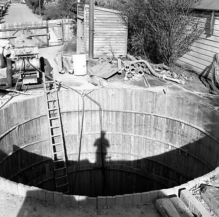a. Interior views of. Workmen constructing underground pumping station
