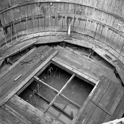 d. Interior views of. Workmen constructing underground pumping station
