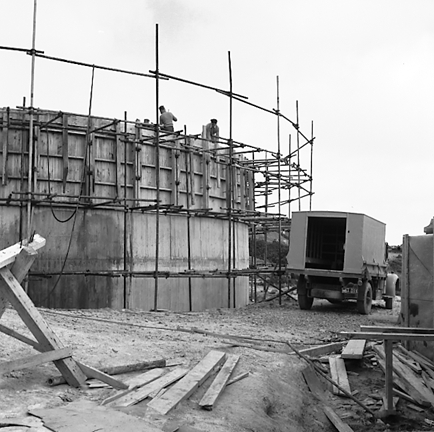 f. Interior views of. Workmen constructing underground pumping station