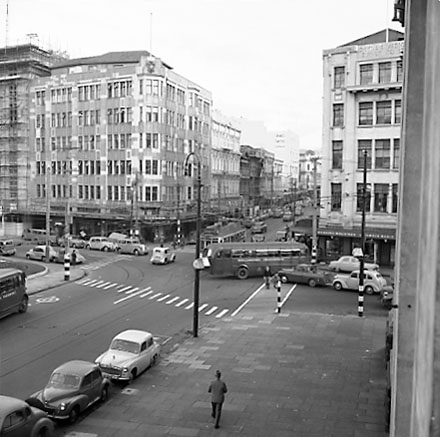 c. Elevated view of intersection, from roof of Town Hall Portico. Civic Chambers building (25-31 Cuba Street, 132-136 Wakefield Street) on the opposite corner, next to Anvil House (138-140 Wakefield Street) under construction. Motor vehicles, trolley bus,