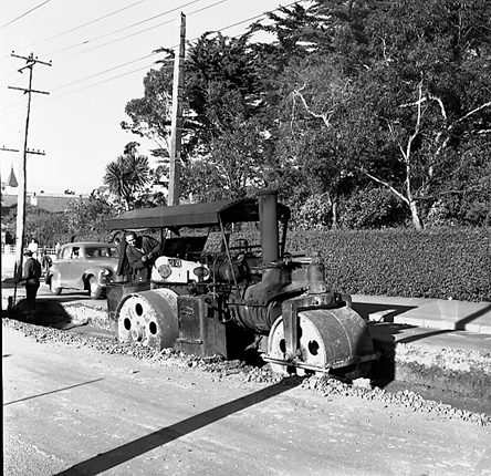 c. Views of workmen re surfacing the road. Machinery and motor vehicles