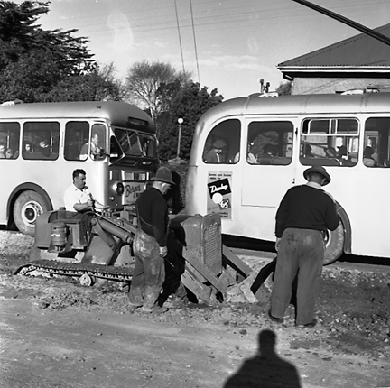 d. Views of workmen re surfacing the road. Machinery and motor vehicles