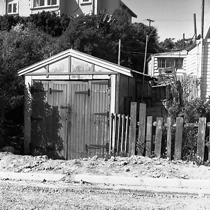 d. Single storey wooden dwelling