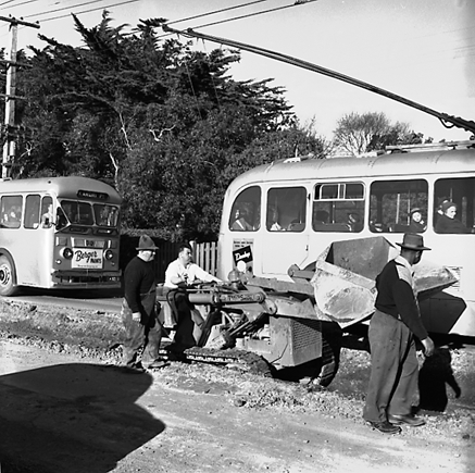 e. Views of workmen re surfacing the road. Machinery and motor vehicles