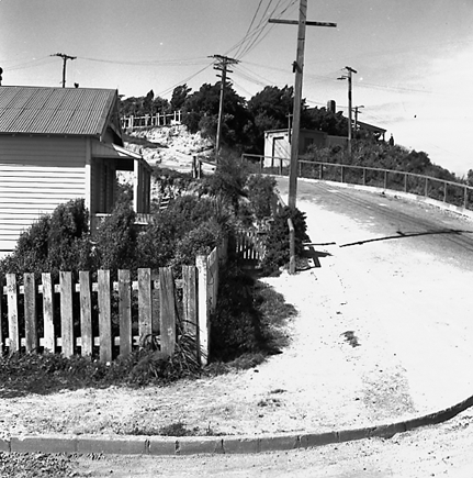 e. Repairs to road, footpath and kerbing. Area of wooden dwellings