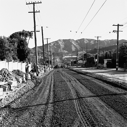 j. Views of workmen re surfacing the road. Machinery and motor vehicles