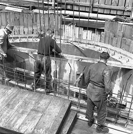 b. Workmen in base of underground pumping station, interior