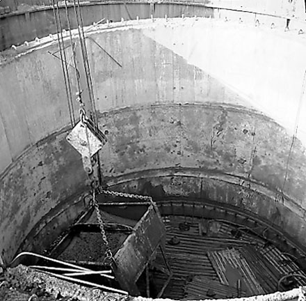 c. Construction of pumping station, workmen, machinery