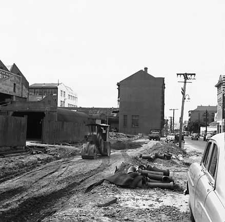 c. Various views of Taranaki Street road works. Includes Traffic Offices directing traffic, the Panama Hotel on the corner of Vivian Street, Wright Stevenson Building, workmen and equipment, and motor vehicle