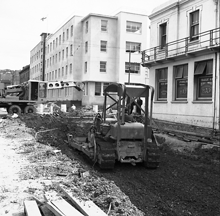 d. Various views of Taranaki Street road works. Includes Traffic Offices directing traffic, the Panama Hotel on the corner of Vivian Street, Wright Stevenson Building, workmen and equipment, and motor vehicle