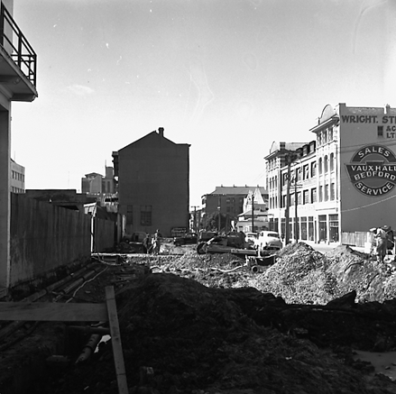 g. Various views of Taranaki Street road works. Includes Traffic Offices directing traffic, the Panama Hotel on the corner of Vivian Street, Wright Stevenson Building, workmen and equipment, and motor vehicle