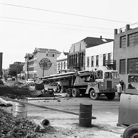 j. Various views of Taranaki Street road works. Includes Traffic Offices directing traffic, the Panama Hotel on the corner of Vivian Street, Wright Stevenson Building, workmen and equipment, and motor vehicle