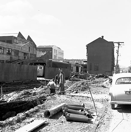 o. Various views of Taranaki Street road works. Includes Traffic Offices directing traffic, the Panama Hotel on the corner of Vivian Street, Wright Stevenson Building, workmen and equipment, and motor vehicle