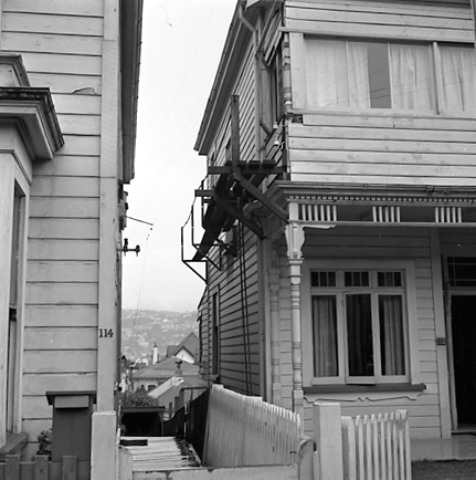 a. Interior and exterior views of a two storey wooden dwelling. Faulty plumbing and wiring