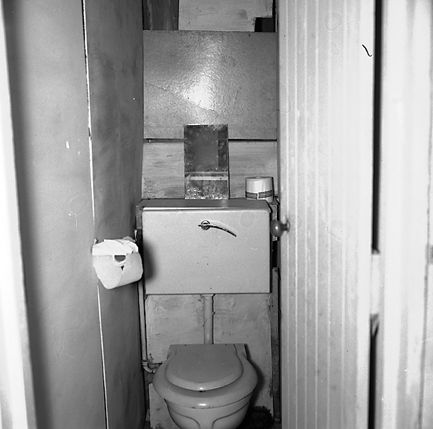 f. Interior and exterior views of a two storey wooden dwelling. Faulty plumbing and wiring