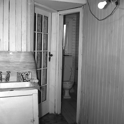 k. Interior and exterior views of a two storey wooden dwelling. Faulty plumbing and wiring