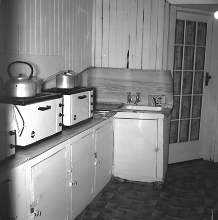 n. Interior and exterior views of a two storey wooden dwelling. Faulty plumbing and wiring