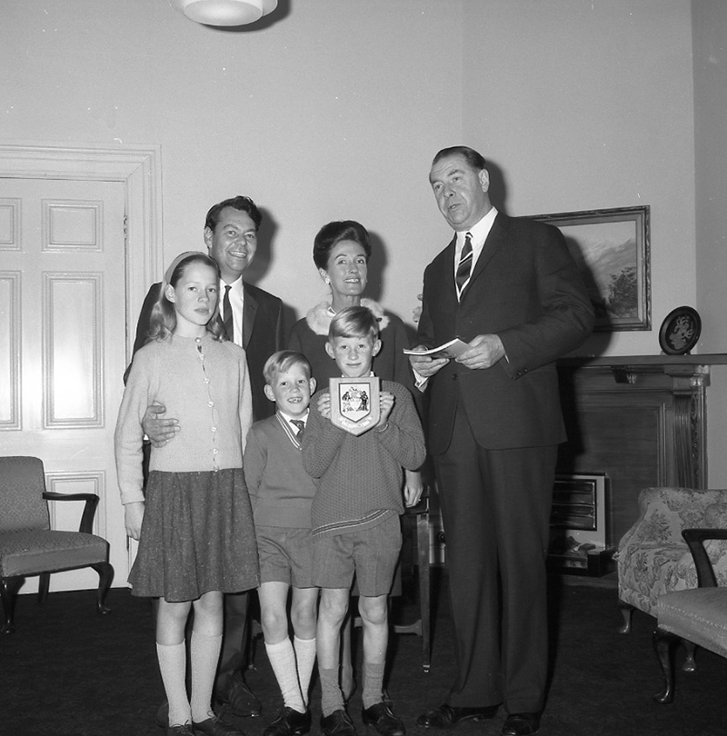 a. Mayor's room, boy presenting plaque to Mayor