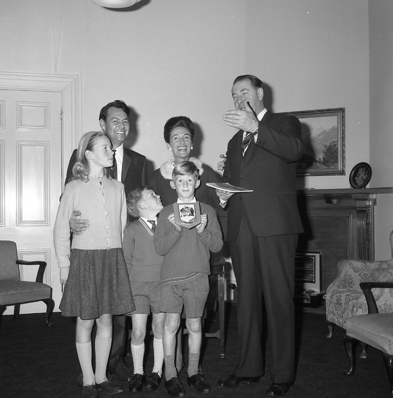 b. Mayor's room, boy presenting plaque to Mayor
