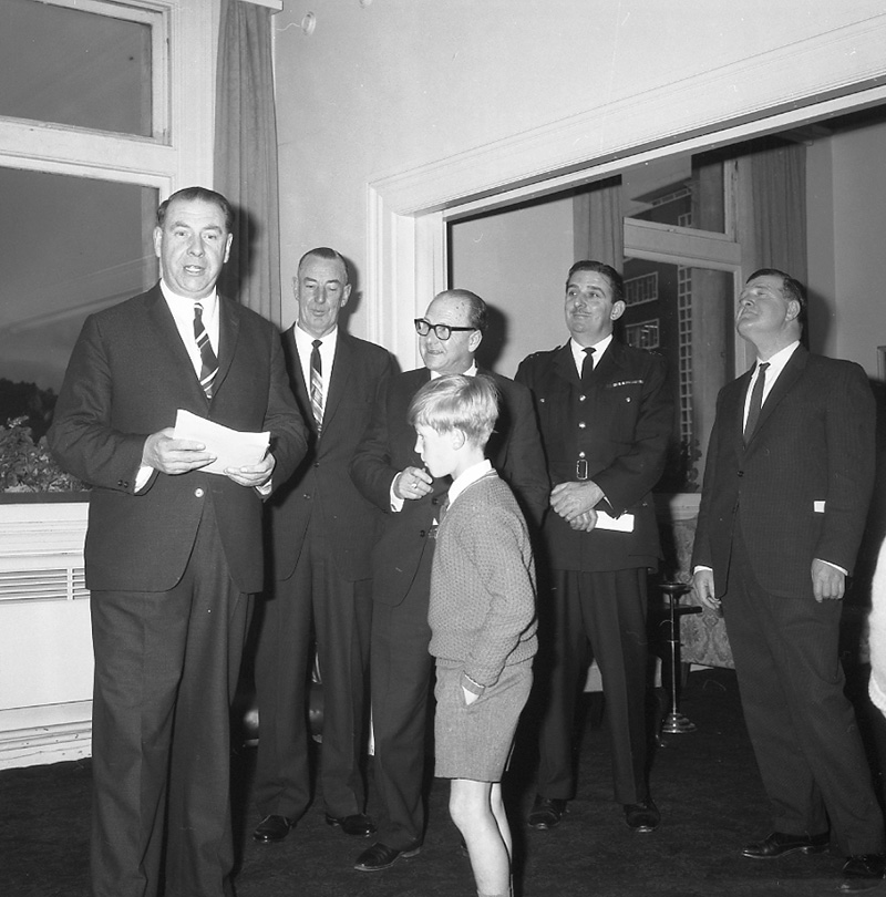 c. Mayor's room, boy presenting plaque to Mayor