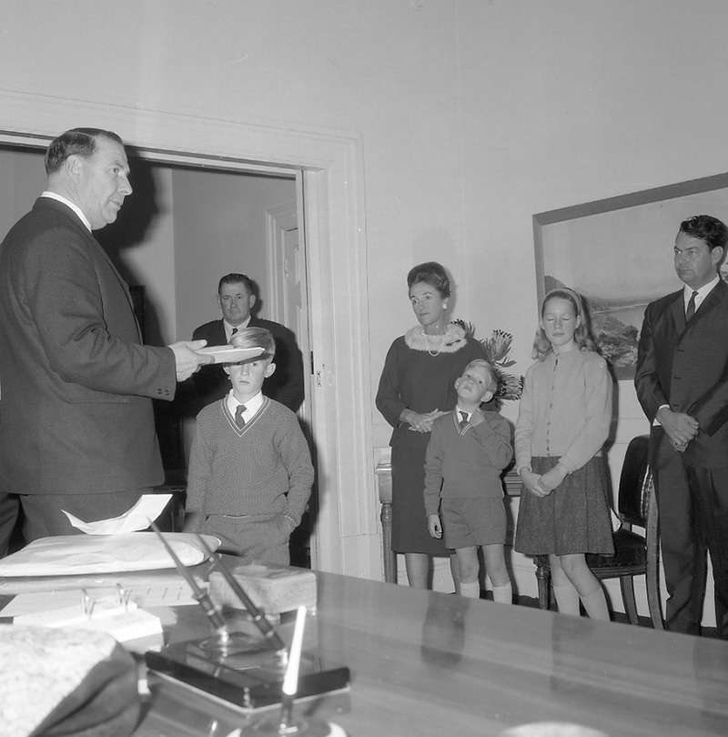 f. Mayor's room, boy presenting plaque to Mayor