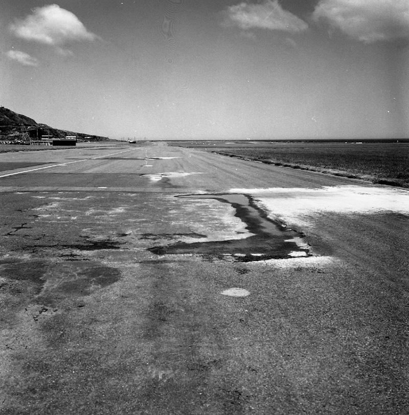 d. Airport runway surface flaws