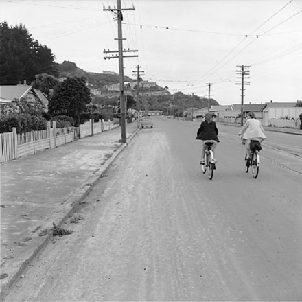 b. Two girls on bicycles in foreground