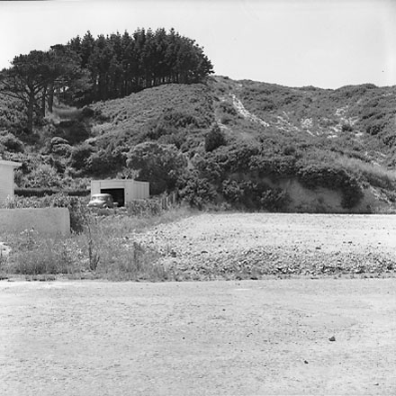 a. Interior of drainage tunnel, workman inside drainage tunnel