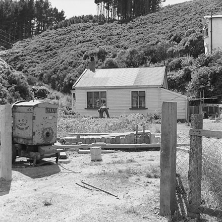 d. Interior of drainage tunnel, workman inside drainage tunnel