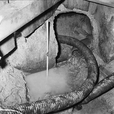 g. Interior of drainage tunnel, workman inside drainage tunnel