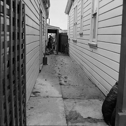 j. views of 91 Waripori Street [Te Wharepōuri Street], a wooden dwelling affected by flooding