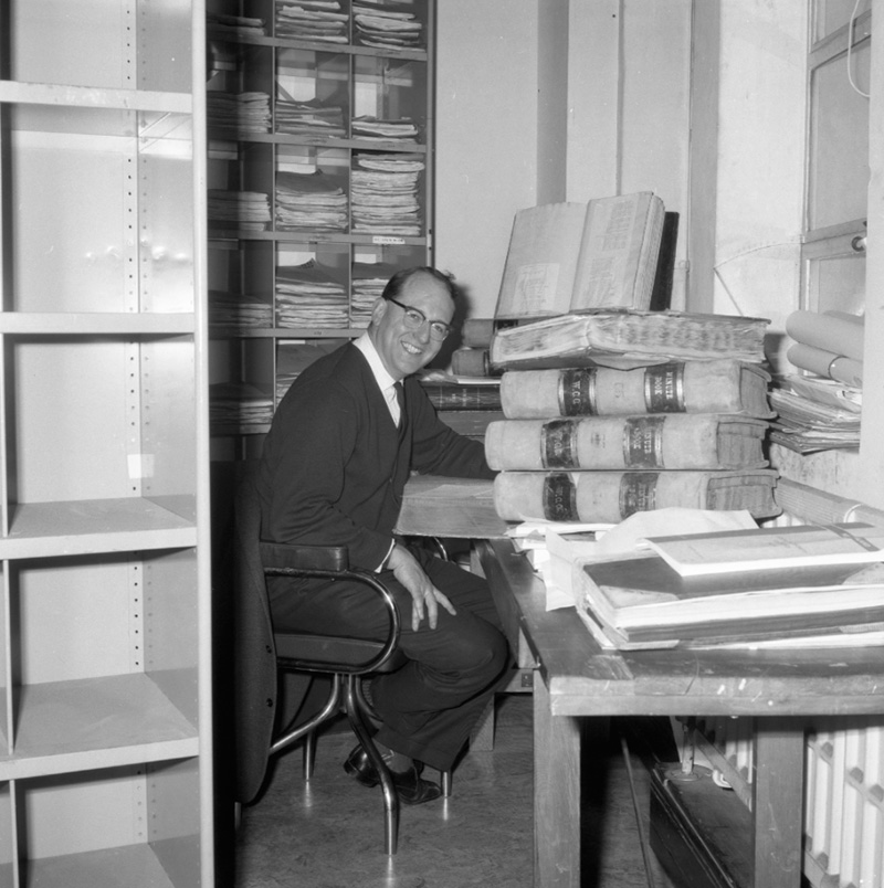 a. George Betts, author, at desk