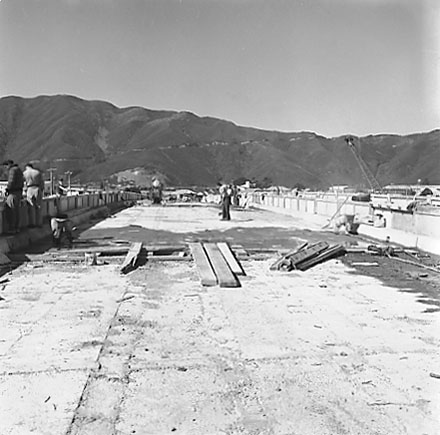 a. New bridge is being constructed, workmen