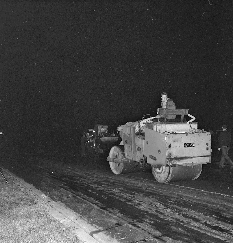 l. Airport, night paving of runway