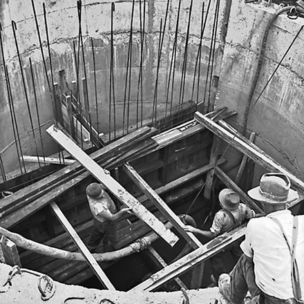 b. Workmen constructing inside of pumping station