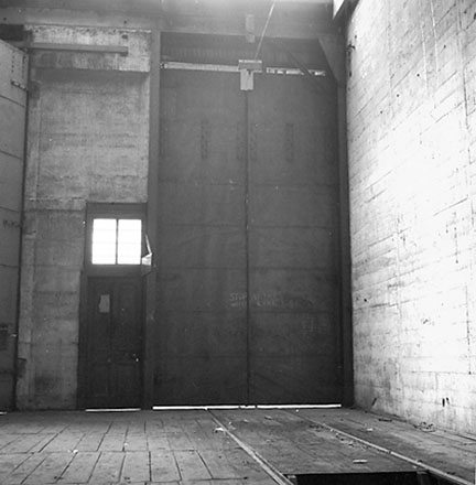 o. Interior of Tram Barns, parked tramcars, motor vehicles, tramlines