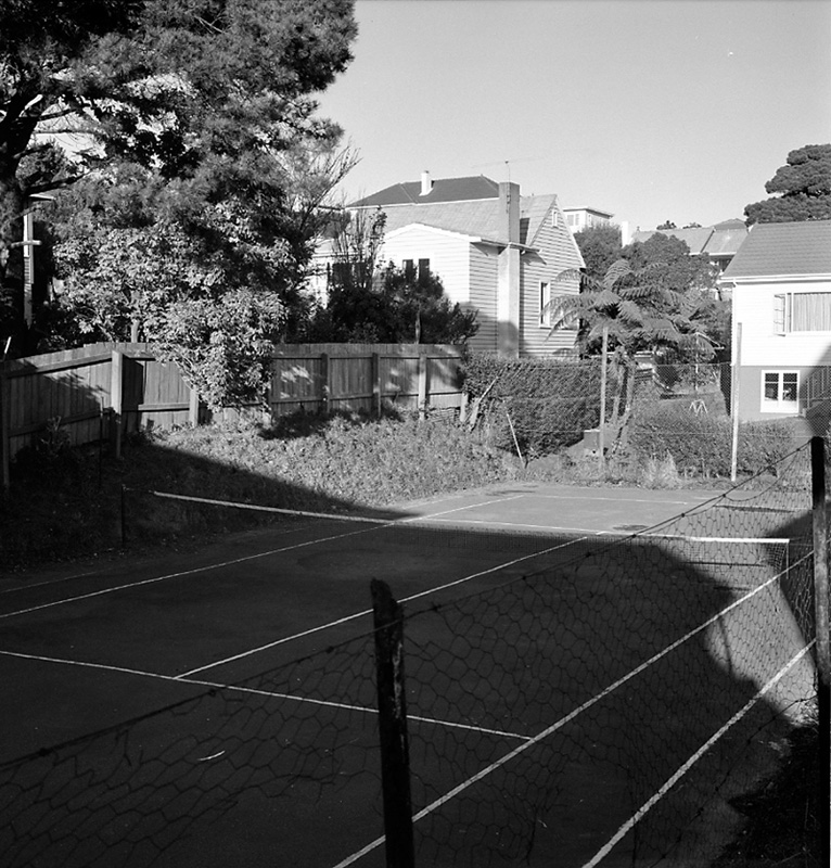 f. Tennis courts at rear of church
