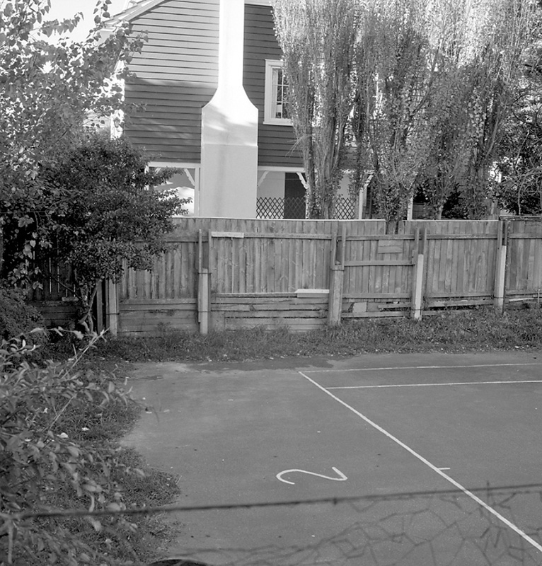 l. Tennis courts at rear of church