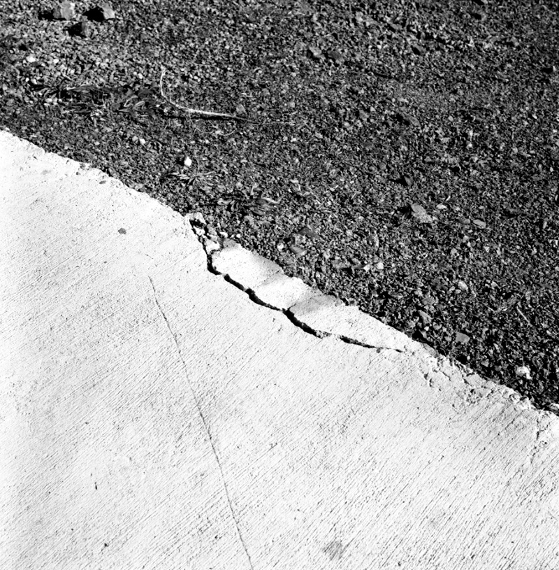 e. Cracked footpath, Woodhouse Avenue