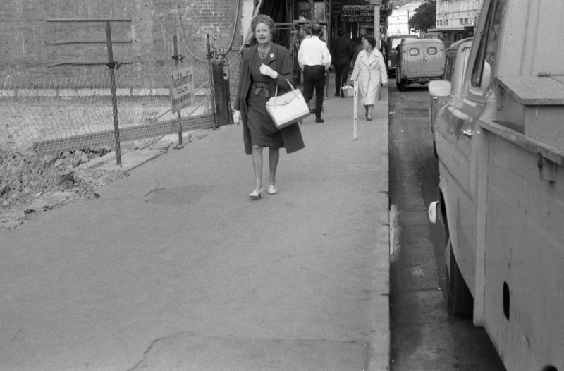 ad. Footpaths - various streets. Lombard Street Parking building from Manners St