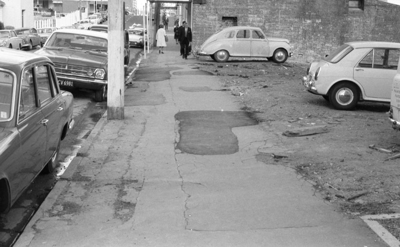 d. Footpaths - various streets. Lombard Street Parking building from Manners St