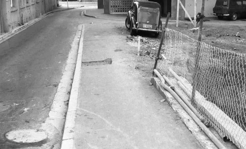 h. Footpaths - various streets. Lombard Street Parking building from Manners St