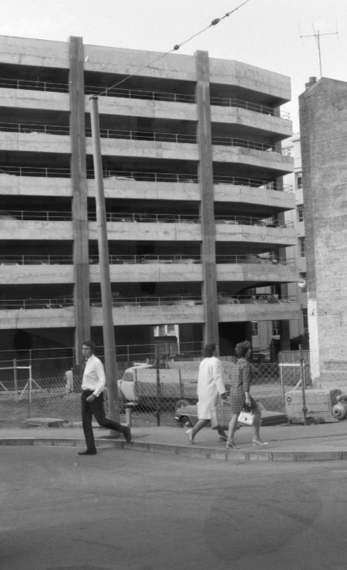 i. Footpaths - various streets. Lombard Street Parking building from Manners St