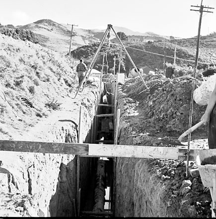 a. Drainage pipes being laid in trenches