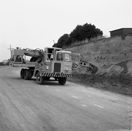 b. Gradall removing bank