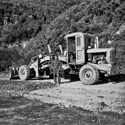 h. Workman with front end grader