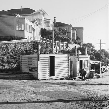 b. Possible repairs to drains in progress. Wellington City Council worksheds, workmen, residential area