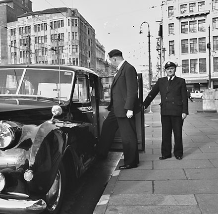 a. Mayor Frank Kitts getting into vehicle